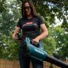 Women's Innovation Tee - woman wearing while starting leaf blower.
