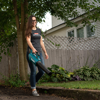 Women's Innovation Tee - woman modeling with leaf blower